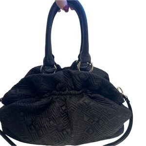 The limited small pouch bag. Beige inside w pocket. This purse looks brand new